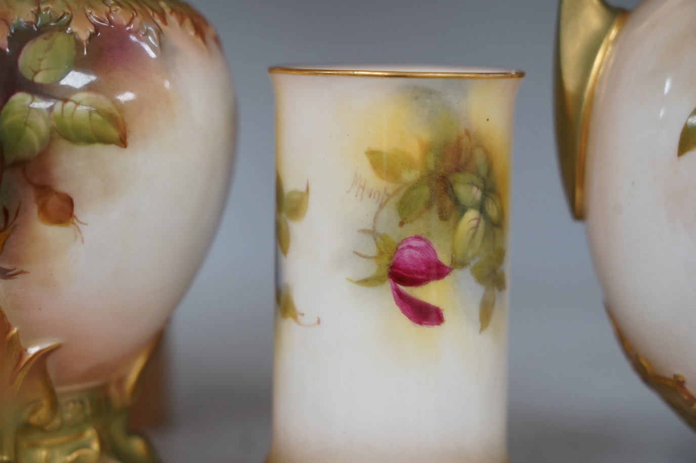 Three Royal Worcester rose painted vases, numbers 1684, 245 and 2510, tallest 18cm. Condition - good